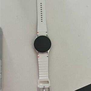 Samsung Smartwatch with White Strap and Black Face